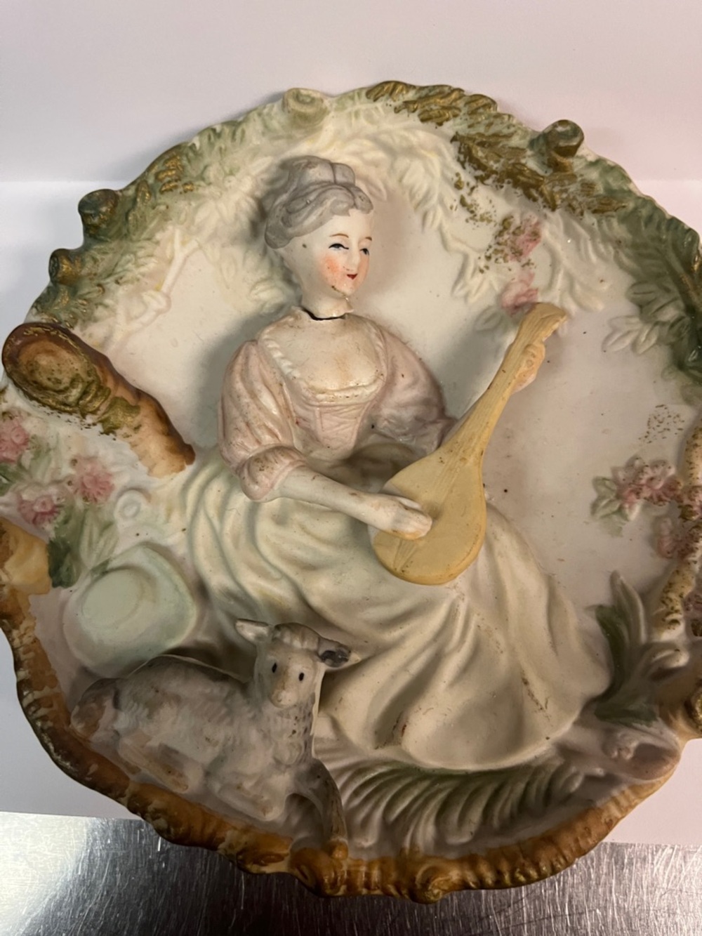 Source Unknown Cream and Pastel Woman with Mandolin Wall Plaque. Head broke off